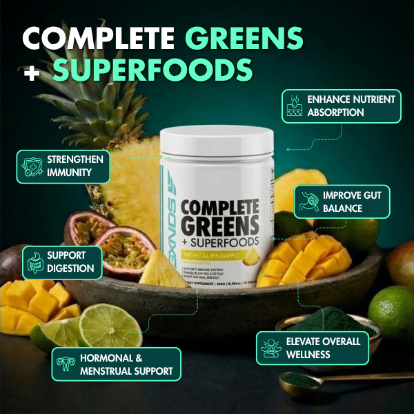 Complete Greens + Superfoods supplement with tropical pineapple flavor, surrounded by fresh fruits for immune, gut, and hormonal support
